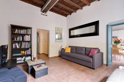 a living room with a couch and a tv at Domus Florea in Rome