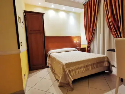 a hotel room with a bed in a room at Hotel Valentino Palace in Rome