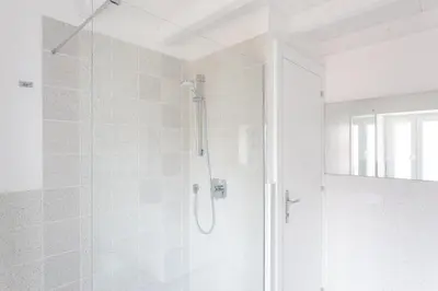 a shower with a glass door in a bathroom at Lilli Vatican White Domus in Rome