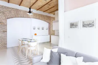 a living room with a couch and a table at Lilli Vatican White Domus in Rome