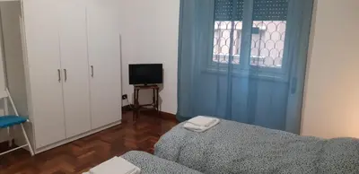 a living room with a couch and a window at A casa di Robi in Rome