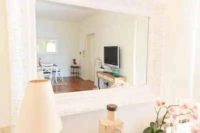 a living room with a large mirror and a living room at Romantic Flat near Metro Flaminio in Rome