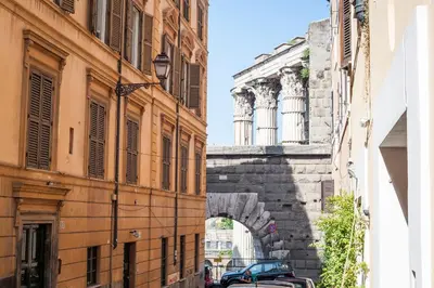 an alley between two buildings in a city at Rome As You Feel - Baccina 95 Forum Apartment in Rome