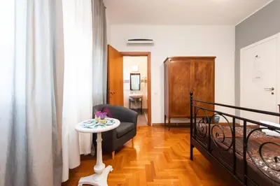 a living room with a couch and a table at L'Imperiale RomaTrastevere in Rome