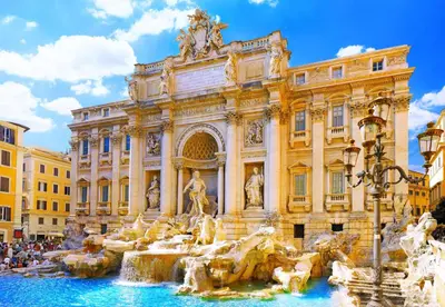 a building with a fountain in front of a building at Roma Centrale Fidelis in Rome