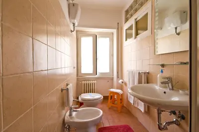 a bathroom with a sink and a toilet at B&B Roma Appia Davila25 in Rome