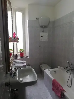 a bathroom with a sink and a tub and a toilet at La Risorgente B&B in Rome