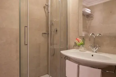a bathroom with a sink and a shower at Hotel Della Conciliazione in Rome