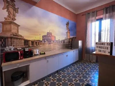 a kitchen with a wall mural of a city at Virgilio Suite in Rome