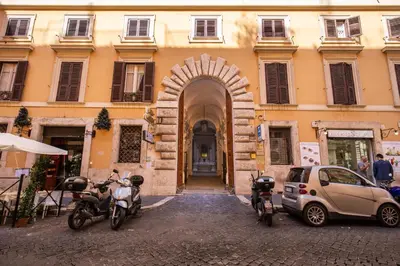 two motorcycles parked in front of a building at DeCharme apartment with terrace in Monti in Rome