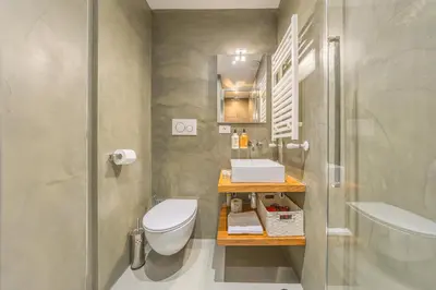a bathroom with a toilet and a sink and a shower at La Vaticana - Saint Peters View - Apt Rome in Rome