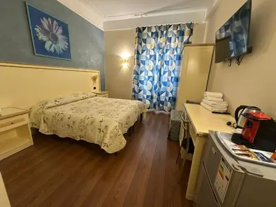 a hotel room with a bed and a desk at Termini station holidays in Rome