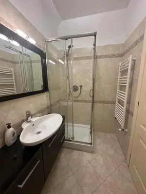 a bathroom with a glass shower and a sink at Termini station holidays in Rome
