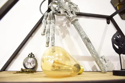 a clock and a glass bottle on a table at Damiva in Rome