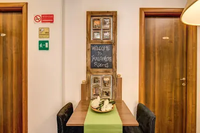 a table with a plate of food on it at Trastevere Rooms in Rome