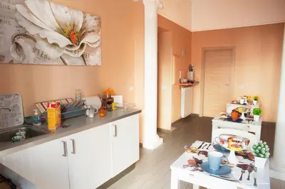 a kitchen with a sink and a counter top at Merulana Suite in Rome