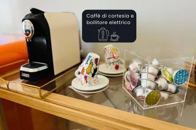 a counter with cups and a coffee maker on it at Bon Ton Design Rooms by DOT Suites in Rome