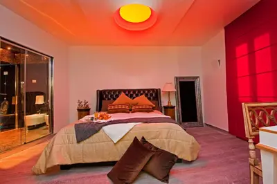 a bedroom with a large bed with a red ceiling at Pantheon Relais in Rome