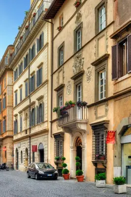 a car parked in front of a large building at Relais Giulia in Rome