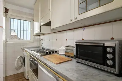 a kitchen with a counter top with a microwave at Le case di Andrea Piccolomini San Peter - Terrace Flat in Rome
