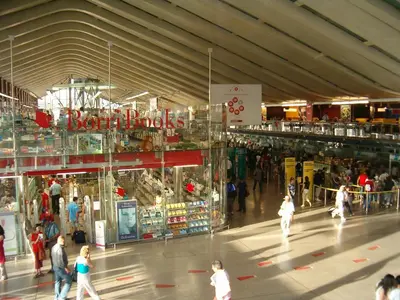 a group of people walking in a shopping mall at Clara Domus in Rome