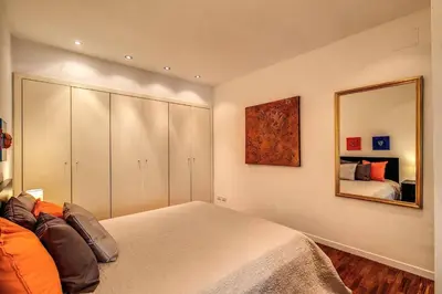 a bedroom with a bed and a mirror at Lovely apartment close Vatican in Rome
