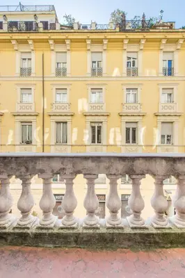 a building with a balcony in front of it at Home Of Arts in the Center in Rome