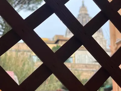 a view of the cathedral from a window at Vista Cupola House in Rome