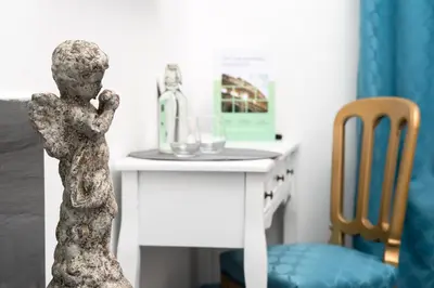 a statue of a person standing next to a desk at Art Atelier Borgo in Rome