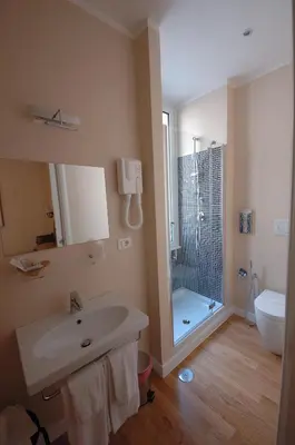 a bathroom with a sink and a shower and a toilet at Residenza Dei Gracchi in Rome