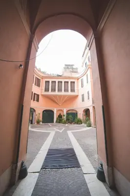 an entrance to a building with an archway at Trevi Portrait in Rome