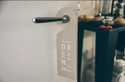 a doorhandle to a refrigerator with a sign on it at Spagna Rooms in Rome