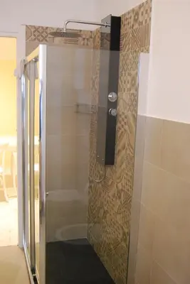 a shower with a glass door in a bathroom at Jubilee 3 Luxury apartment in Rome Vatican in Rome