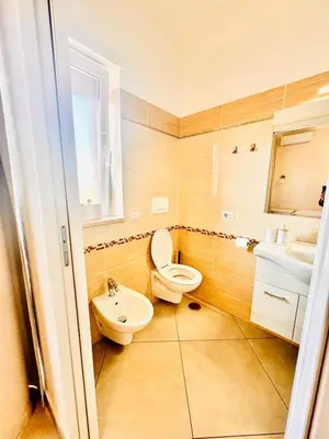 a bathroom with a toilet and a sink at Dodo Holiday in Rome in Rome
