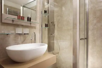 a bathroom with a white sink and a shower at Magica Luna Boutique Hotel - Roma in Rome