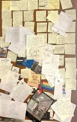 a pile of sticky notes on a table at A Casa di Giulia in Rome