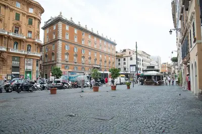 a cobblestone street in a city with buildings at A Casa di Giulia in Rome