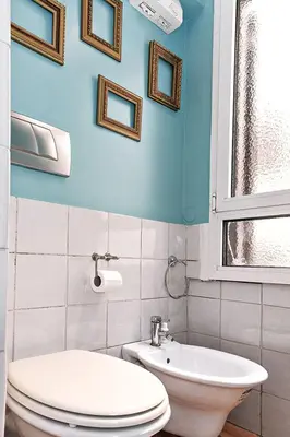 a bathroom with a toilet and a sink at Sweet Rome Colosseo in Rome