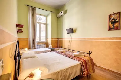 a room with two beds and a window at GuestHouse o Affittacamere Magenta Baylon Suite in Rome