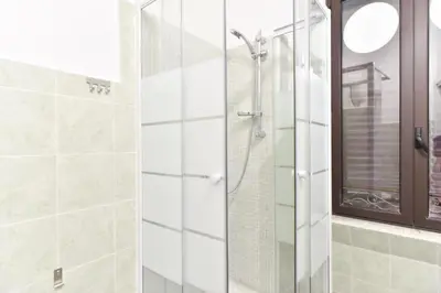 a shower with a glass door in a bathroom at GuestHouse o Affittacamere Magenta Baylon Suite in Rome