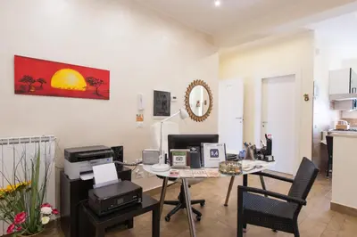 a room with a desk with a computer and chairs at Alba Romana in Rome