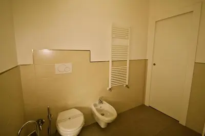 a small bathroom with a toilet and a sink at Alba Romana in Rome