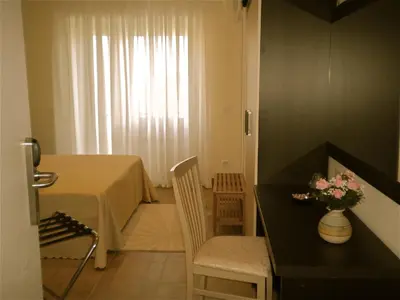 a small room with a table and a table and chairs at Alba Romana in Rome