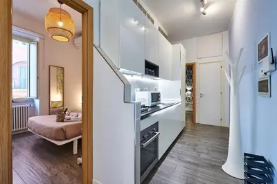 a small apartment with a kitchen and a living room at Good Vibes Rome comfort and quality in Rome