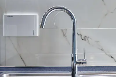 a kitchen sink with a chrome kitchen faucet at Good Vibes Rome comfort and quality in Rome