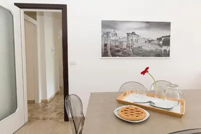 a dining room table with a plate of waffles on it at Ad Astra Suite in Rome