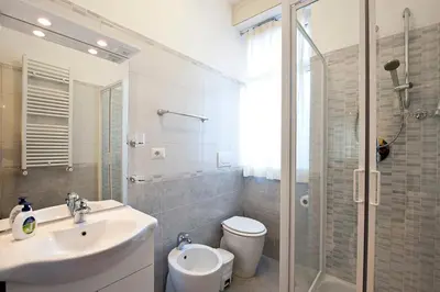 a bathroom with a sink and a toilet and a shower at B&B La Porta in Rome