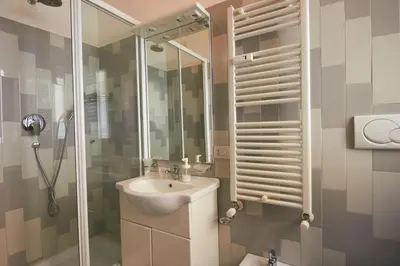 a bathroom with a sink and a shower at B&B La Porta in Rome