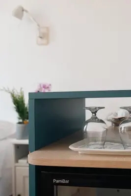 a counter with two glass dishes on a plate at Residenza I Rioni Guesthouse in Rome