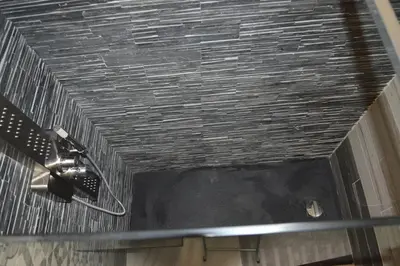 a bathroom with a ceiling with a shower at Apartment Silvestri in Rome